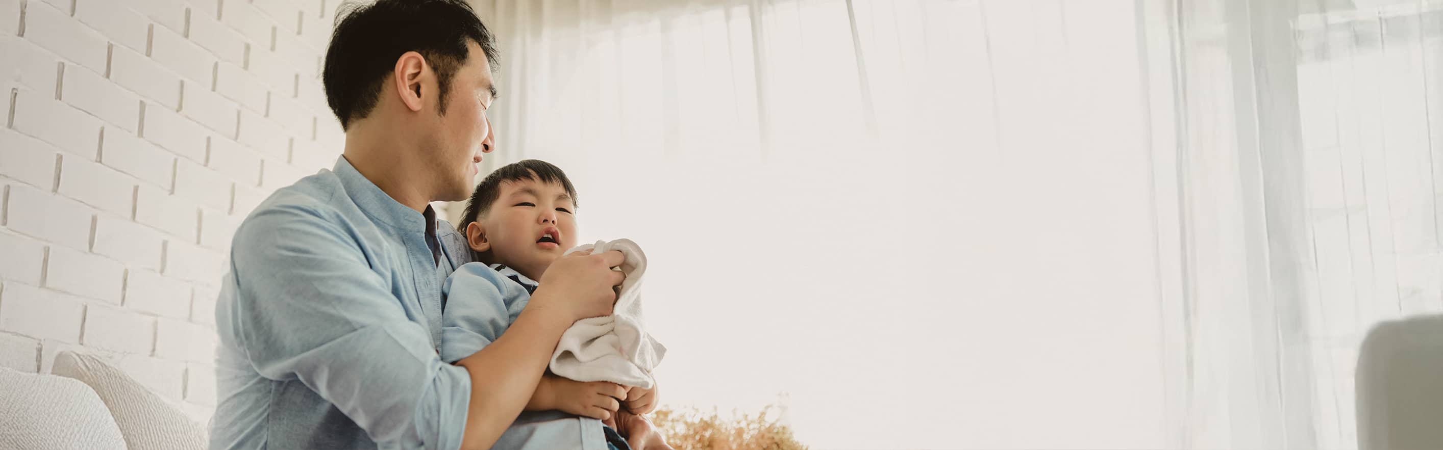 Father holding toddler