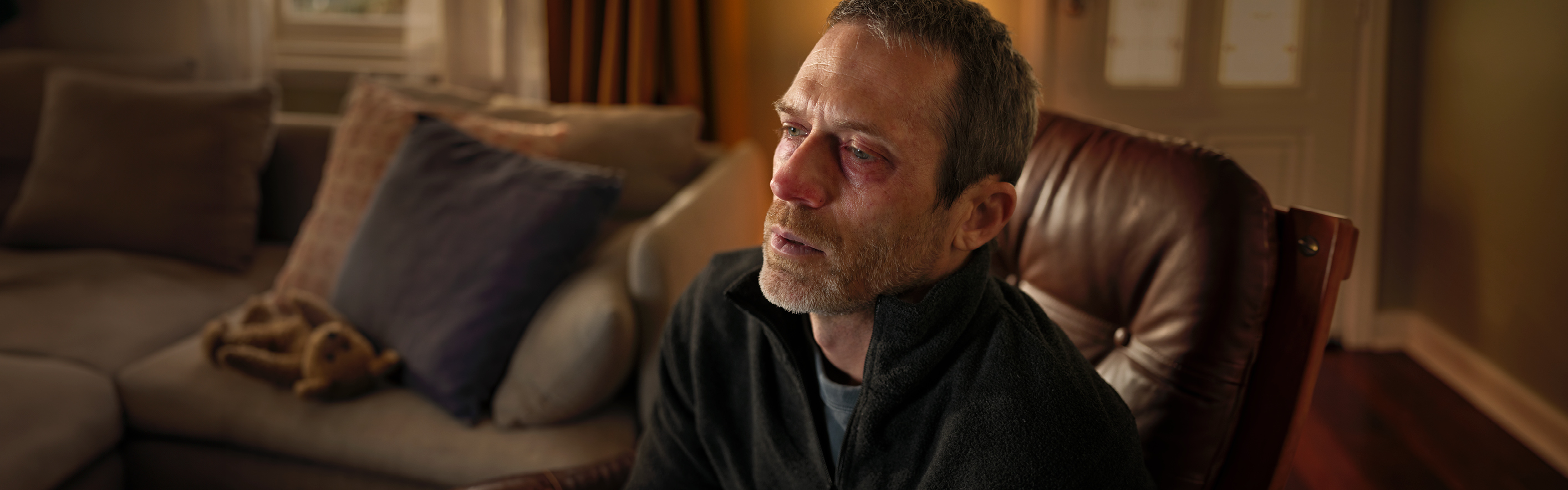 man at home in lounge room