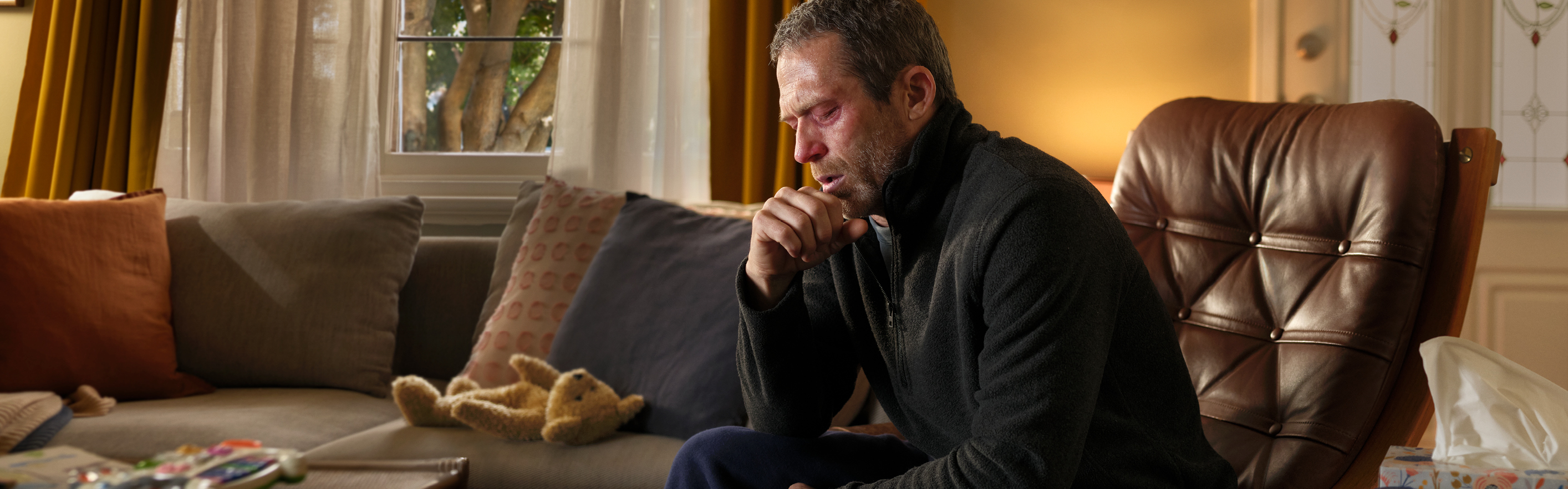 man at home in lounge room