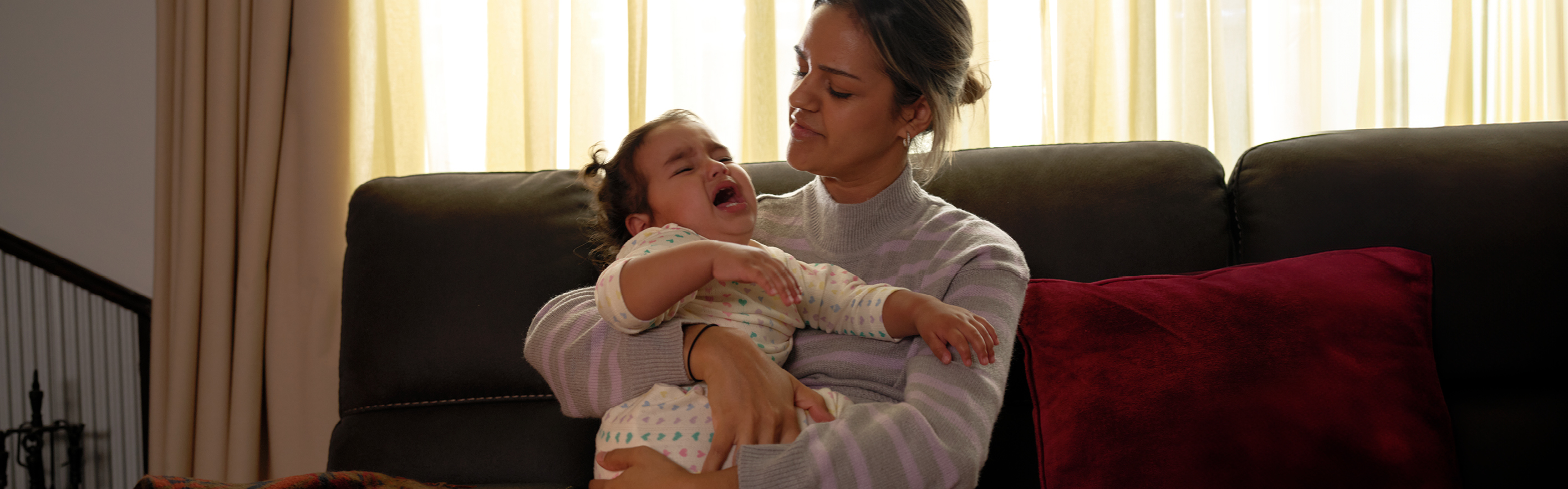 mother holding toddler