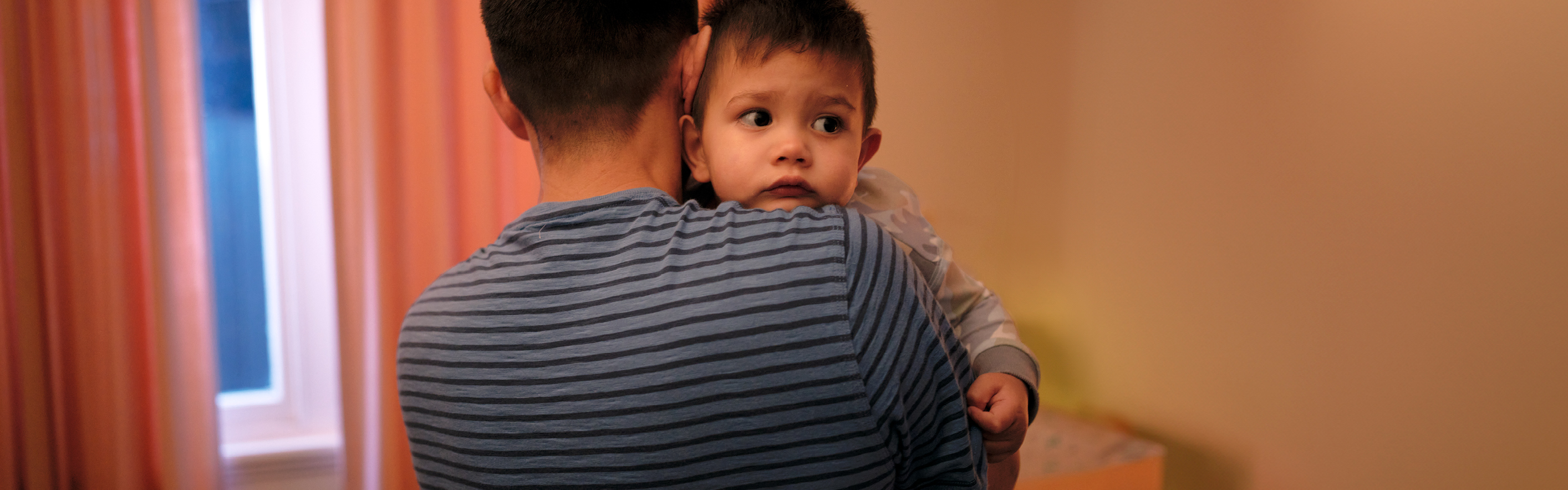 Father holding toddler