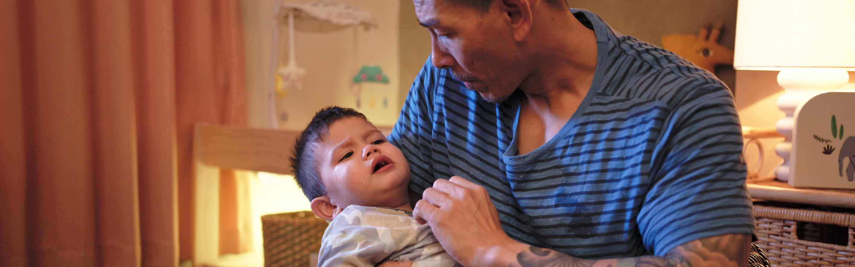 Father holding toddler