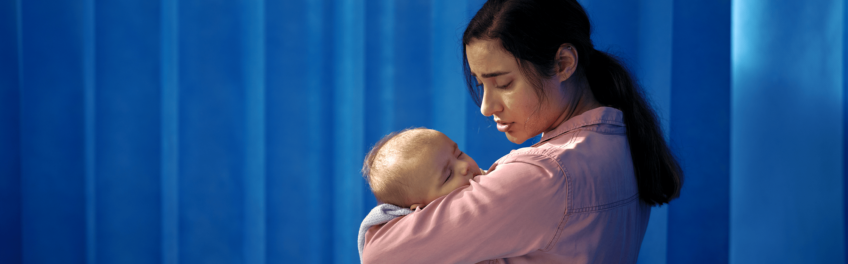 Moman holding baby in the hospital