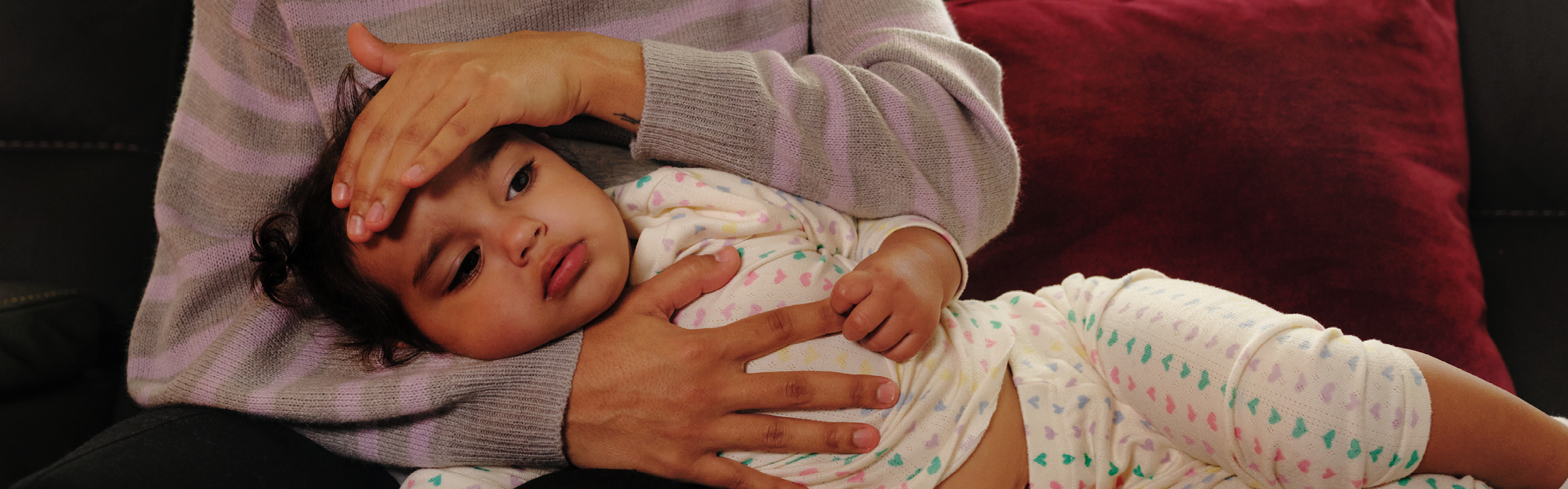 mother holding toddler